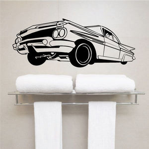 Lowrider car decal, black-and-white line art with wheels and front view
