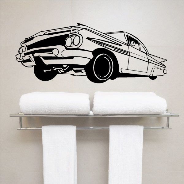 Lowrider car decal, black-and-white line art with wheels and front view