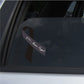 Vinyl ribbon sticker with 911 Never Forget text on dark window