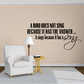 Black wall quote decal: “A bird does not sing...” with flowing “sing” script