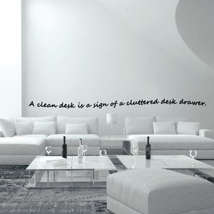 Wall quote mural decal text: 'A clean desk is a sign of a cluttered desk drawer.'