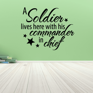 Wall decal with text: “A Soldier lives here with his commander in chief” and stars