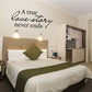 Cursive wall decal: “A true love story never ends” with arrow accents