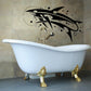 Abstract whale and moon wall decal in black with dotted bubbles and sweeping lines