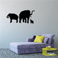 Elephant family wall decal with black silhouettes of two adults and one baby.