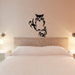 Black owl on branch wall decal
