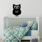 Black owl wall decal with large white eyes and wavy line accents