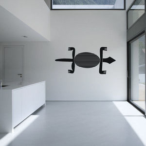 Horizontal lizard wall decal with striped belly and black outline, minimalist design