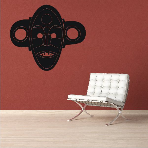 Stylized black monkey mask wall decal with red face details