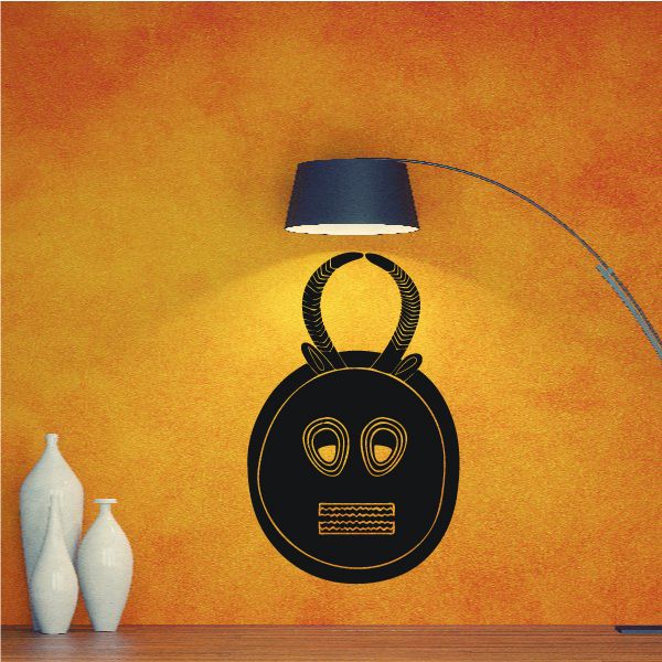 Short horn mask wall decal with circular black face, gold eyes, and curved horns