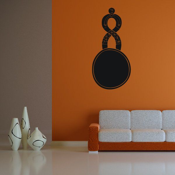 Small figurine on ball wall decal with black figure and circular center