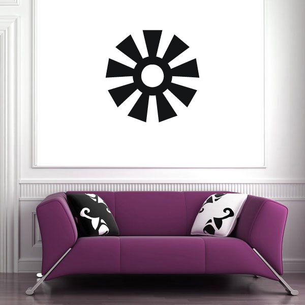 Black sunburst wall decal with circular center and pointed rays