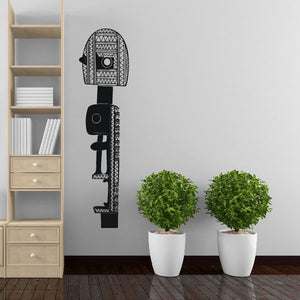 Textured statue wall decal, black geometric standing figure with patterned face