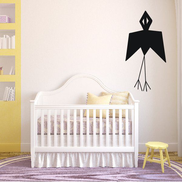 Black flying bird wall decal with geometric shapes and hanging tassel lines