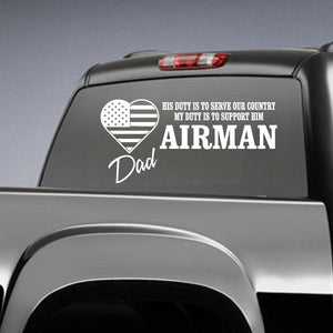 Airman Dad duty decal with heart and text on dark vehicle window, white design