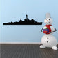 Black destroyer ship decal silhouette, with a small snowman character holding a gift in foreground