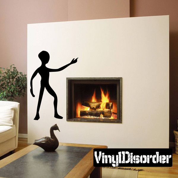Alien pointing decal sticker with black silhouette of alien extending an arm and finger
