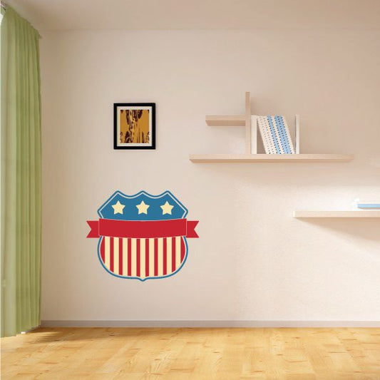 Flag shield sticker with blue stars and red-white striped ribbon