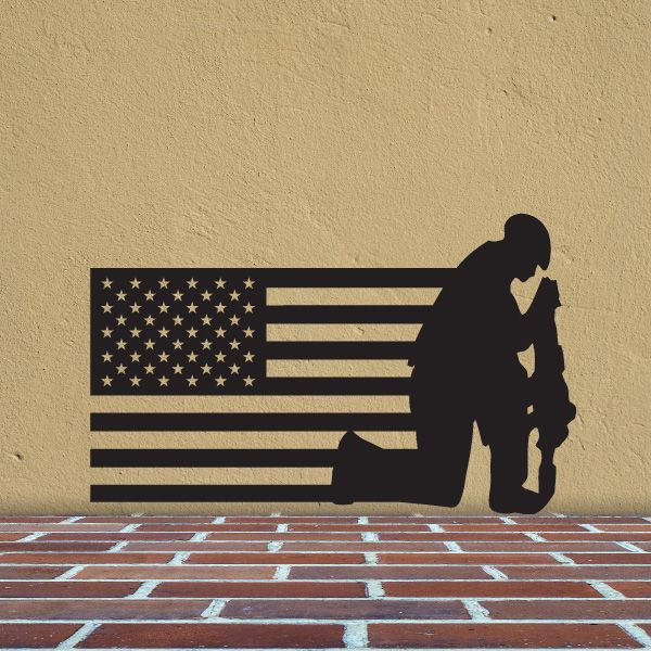 American flag and soldier decal with dark kneeling silhouette and stars-and-stripes flag