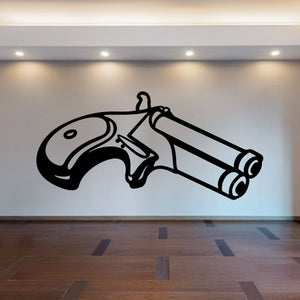 Angled derringer decal, black outlined handgun illustration on light surface