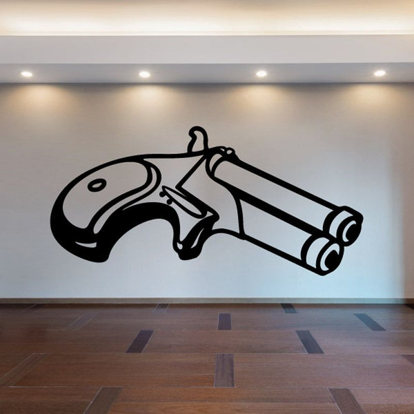 Angled derringer decal, black outlined handgun illustration on light surface