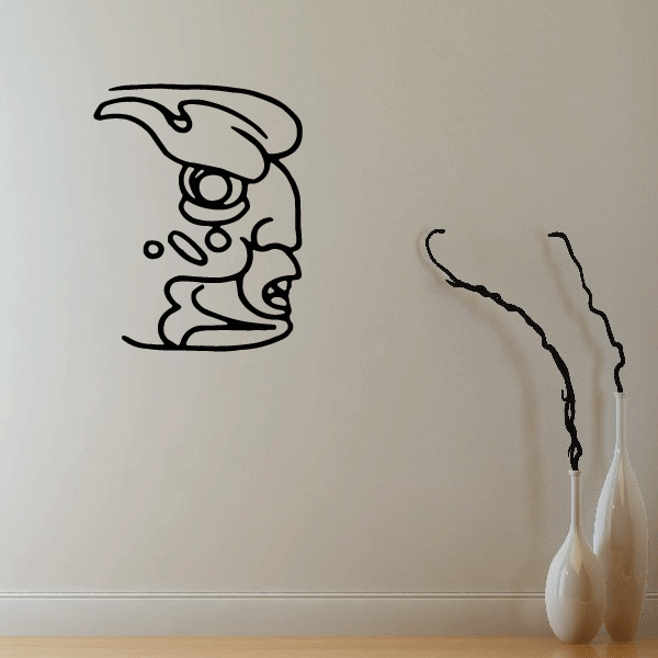 Angry Mayan face decal with thick black outline and headdress