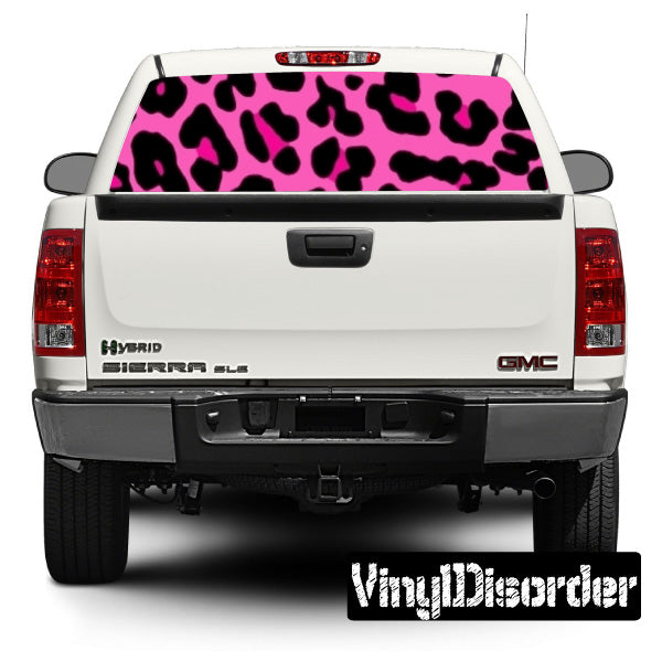 Pink leopard rear window graphic on white pickup truck tailgate