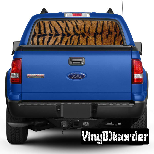 Tiger animal print rear window graphic on blue pickup truck tailgate