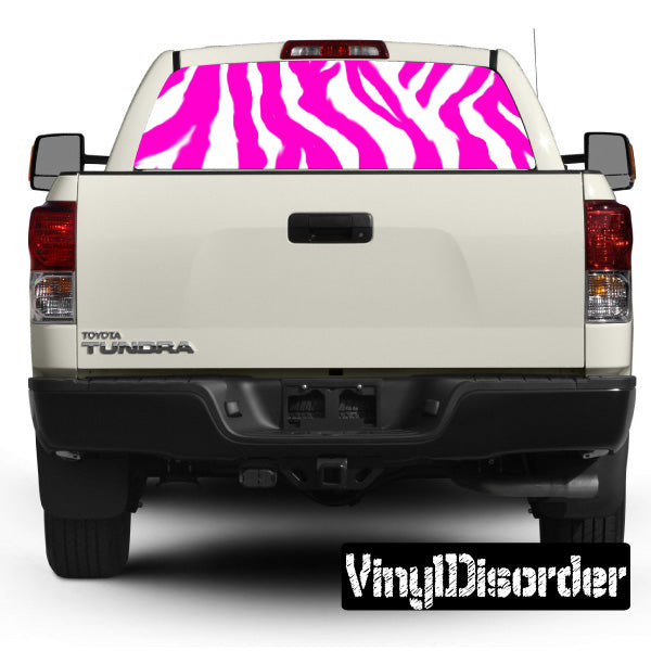 Vehicle rear window graphic with pink zebra stripes and black outline