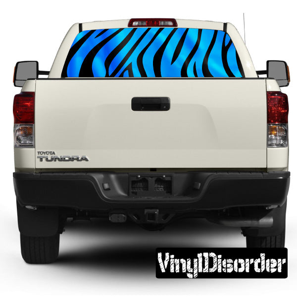 Zebra-striped rear window graphic with blue and black stripes on truck
