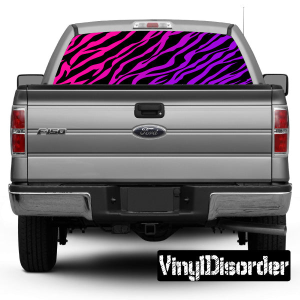 Zebra-pattern rear window view-through graphic in pink and black on a truck.