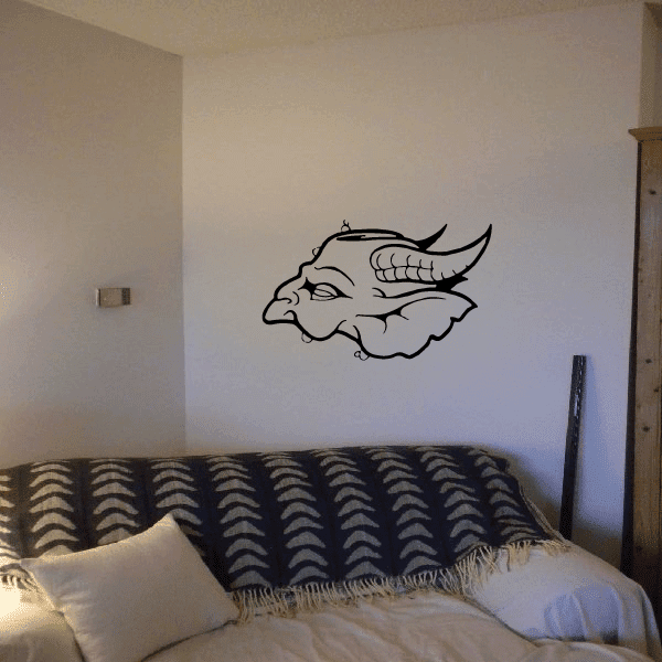 Demon mask decal with fish-like skull outline, curved horns, and dark eye detail