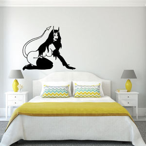 Arched back devil girl wall decal, black silhouette with arched posture and tail.