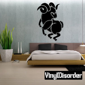 Black ram head wall decal with curled horns and detailed silhouette.