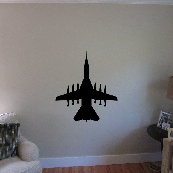 Armed fighter jet wall decal with black aircraft silhouette and missile details