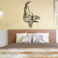 Dragonfly outline decal with armored style wings in black on light wall