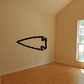 Black left-pointing arrowhead wall decal