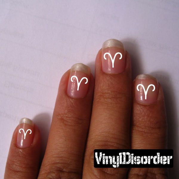 Astrology nail art stickers with white Aries-style curved glyph on nude nails