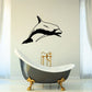 Dolphin swimming forward wall decal, black outline on light background