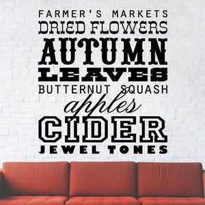 Autumn word collage wall decal with bold black typography and autumn-themed phrases.