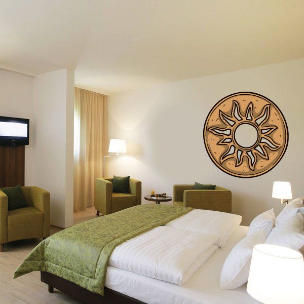 Round Aztec sun wall sticker with brown, tan, and cream patterned rays