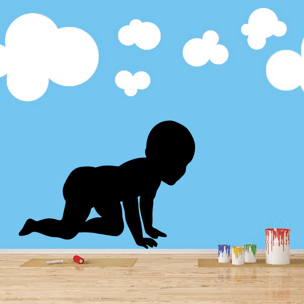 Baby wall decal of a crawling baby silhouette with cloud shapes