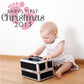 Baby's First Christmas 2015 wall decal with pink footprints and bold script text