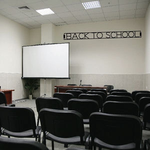 Wall decal reading “BACK TO SCHOOL” in black outlined block letters