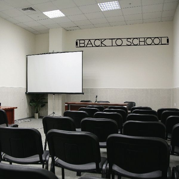 Wall decal reading “BACK TO SCHOOL” in black outlined block letters