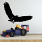 Black bald eagle flying vinyl decal with wings spread and claws extended