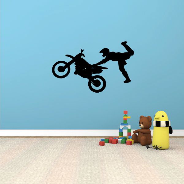 Black dirt bike decal with rider doing kick grab action