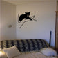 Bear cub in tree wall decal, black silhouette on an angled branch