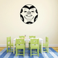 Stylized moon-face wall decal with smiling demon expression in black and cream