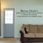 Wall decal with "BEING HAPPY" quote and inspirational text in black